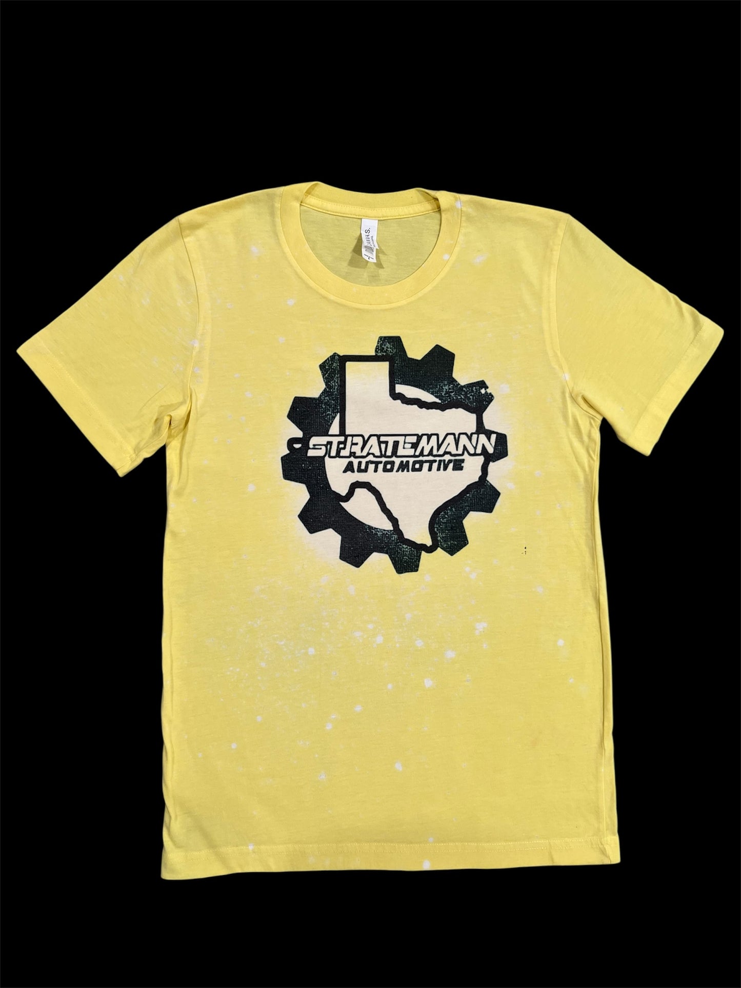 Front of yellow shirt with black logo